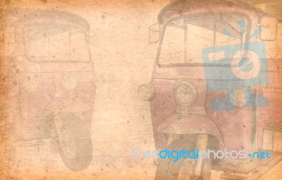 Tuk Tuk Taxi On A Street In The Thai Capital . Added Old Paper Texture Stock Photo