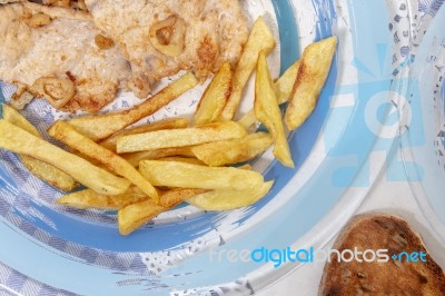 Turkey Steak With French Fries Stock Photo