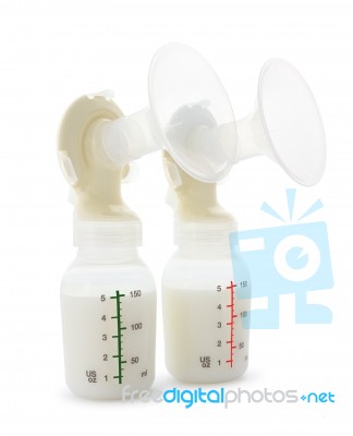Twin Breast Pump And Milk Bottles On White Background Stock Photo