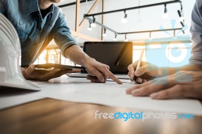 Two Architects Engineer Discussing  Data Working And Tablet, Lap… Stock Photo