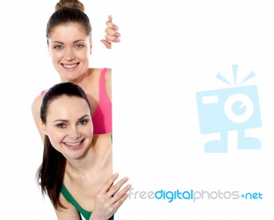 Two Attractive Girls Holding Blank Whiteboard Stock Photo
