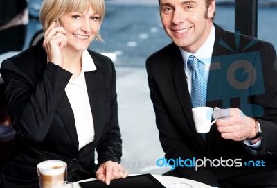 Two Business Professionals At Coffee Shop Stock Photo