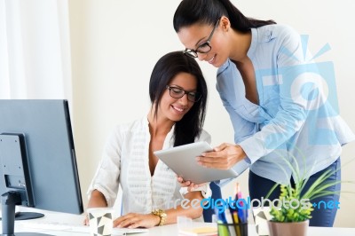 Two Business Woman Working In Office With Digital Tablet Stock Photo Two Business Woman Working In Office With Digital Tablet Stock Photo