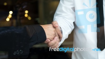 Two Businessman Shaking Hands Greeting Each Other Stock Photo