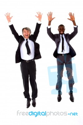 Two Businessmen Jumping Stock Photo