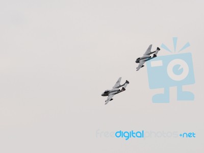 Two De Havilland Vampires Circling Over Dunsfold Airfield Stock Photo