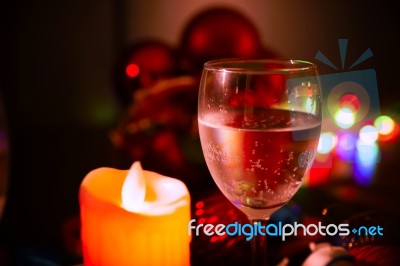 Two Glasses Of Champagne With A Christmas Decor In The Background Stock Photo