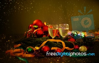 Two Glasses Of Champagne With A Christmas Decor In The Background Stock Photo