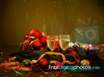 Two Glasses Of Champagne With A Christmas Decor In The Background Stock Photo