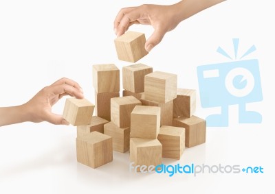 Two Hands Playing Wooden Box On Isolated Background Stock Photo