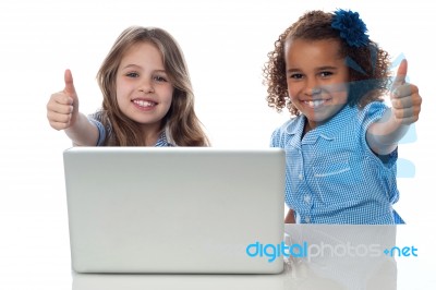 Two Happy Kids Showing Thumbs Up Stock Photo