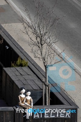Two Mannequins On A Wall In Ortisei Stock Photo