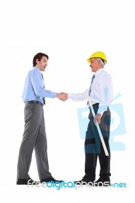 Two Men Shake Hands Stock Photo