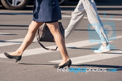 Two Pedestrians Walking Stock Photo