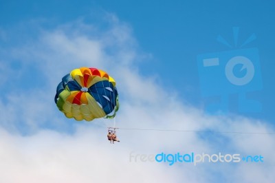 Two People Paragliding Off A Beach In Gran Canaria Stock Photo