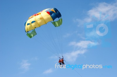 Two People Paragliding Off A Beach In Gran Canaria Stock Photo