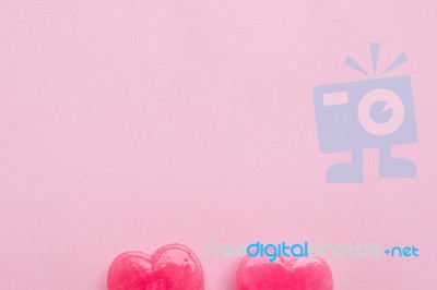 Two Pink Valentine's Day Heart Shape Lollipop Candy On Empty Pastel Pink Paper Background. Love Concept. Top View. Minimalism Colorful Hipster Style Stock Photo