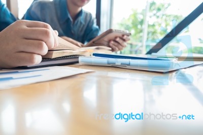 Two Students Studying Together From Text Book, Lifestyle Tutorin… Stock Photo