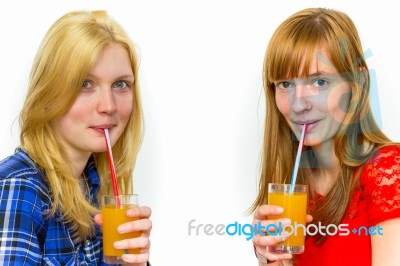 Two Teenage Girls Drinking Soft Drinks Stock Photo