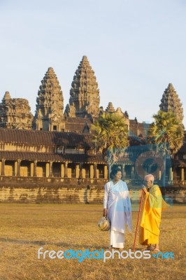 Two Unidentified Buddhist Female Monks Dressed In Orange And Whi… Stock Photo Two Unidentified Buddhist Female Monks Dressed In Orange And Whi… Stock Photo