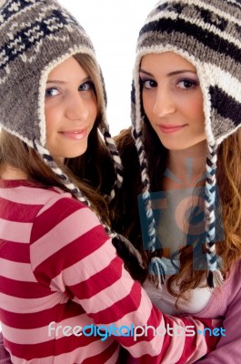 Two Young Friends Wearing Woolen Cap And Looking At Camera Stock Photo Two Young Friends Wearing Woolen Cap And Looking At Camera Stock Photo