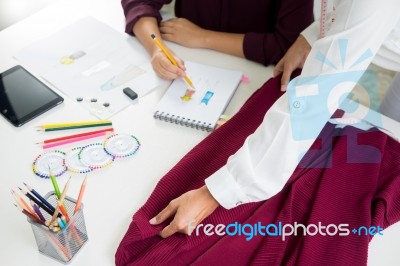 Two Young Women Working As Fashion Designers And Drawing Sketche… Stock Photo