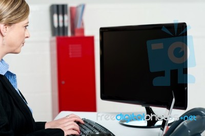 Typing And Looking At Lcd Screen Stock Photo