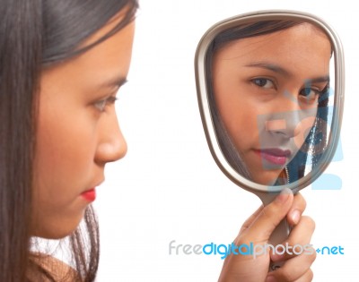Unhappy Girl Looking At Mirror Stock Photo