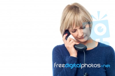 Unhappy Woman On The Phone Stock Photo