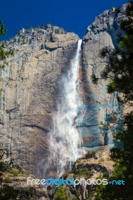 Upper Yosemite Falls Under A Bright Blue Sky Stock Photo