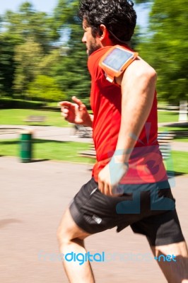 Urban Athlete Doing Sprint In The Park Stock Photo