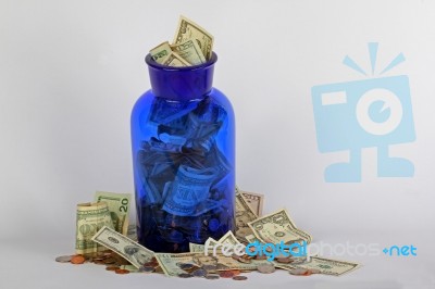 USA Money In Blue Jar Stock Photo USA Money In Blue Jar Stock Photo