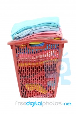 Used Cloths In Old Red Plastic Basket On White Background Stock Photo