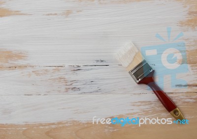 Used Paint Brush On Wooden Floor Background Stock Photo
