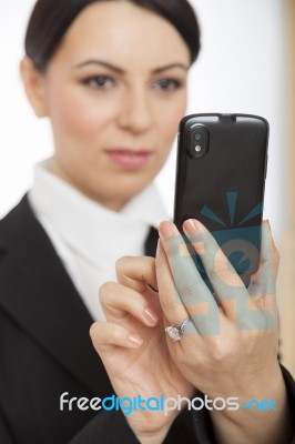 Businesswoman Using Mobile Phone Stock Photo