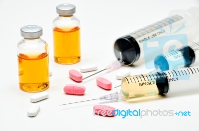 Vaccine / Hypodermic Syringe / Needle / Pills Stock Photo