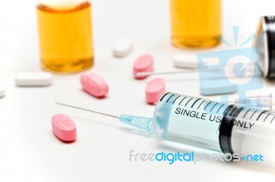 Vaccine / Hypodermic Syringe / Needle / Pills Stock Photo