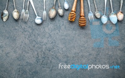 Various Cooking Utensils Border. Spoons And Fork On Dark Stone B… Stock Photo