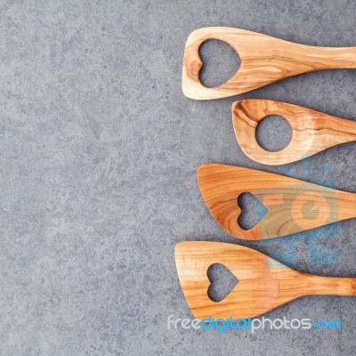 Various Wooden Cooking Utensils Border. Wooden Spoons And Wooden… Stock Photo