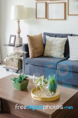 Vase Of Plant On Wooden Table In Living Room Stock Photo