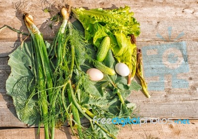 Vegetables And Eggs On Wooden Table Stock Photo