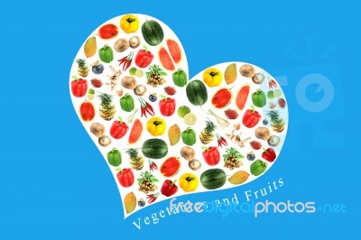 Vegetables And Fruits In White Heart On Blue Background Stock Photo