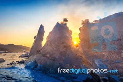 Very Large And Beautiful Chunk Of Ice At Sunrise In Winter Stock Photo