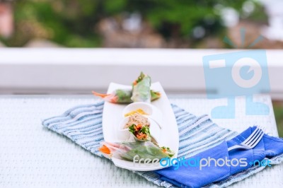 Vietnamese Spring Rolls With Vegetables And Coriander On A Plate… Stock Photo