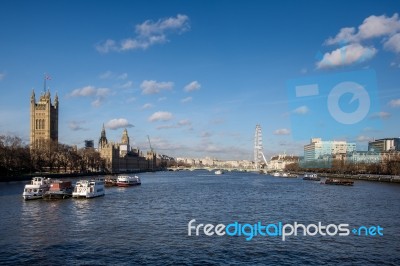 View Along The River Thames To The Houses Of Parliament Stock Photo