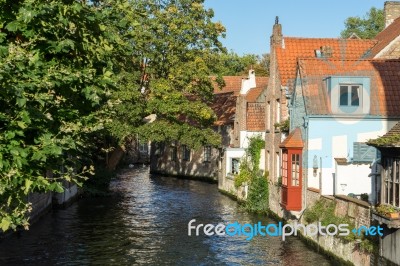 View Down A Canal In Bruges West Flanders In Belgium Stock Photo