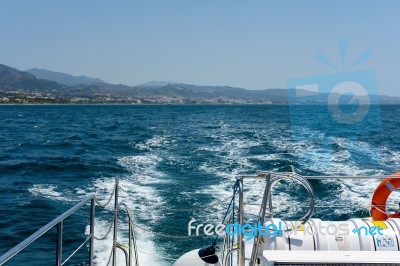 View From The Stern Of A Catamaran At Sea Stock Photo
