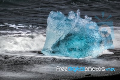 View Of A Small Iceberg On Jokulsarlon Beach Stock Photo