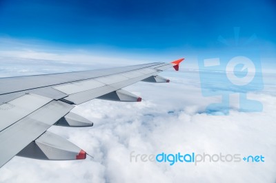 View Of Beautiful Sky With Aircraft Wing From Aircraft Window Stock Photo