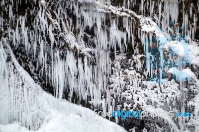 View Of Skogafoss Waterfall In Winter Stock Photo